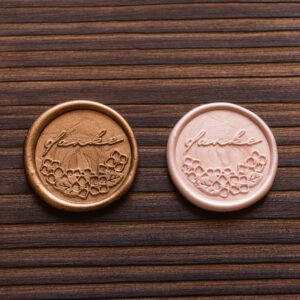 rundes Wachssiegel mit dem Wort danke und Hortensien. Farbe gold und Champagner rosé